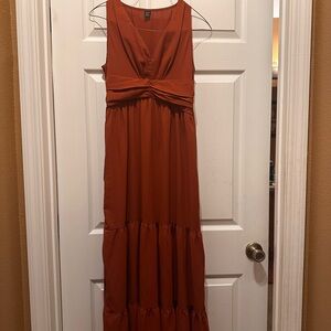 Never worn before Maxi Dress. Orange in color. Size M.